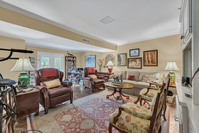 tiled living room with ornamental molding and french doors