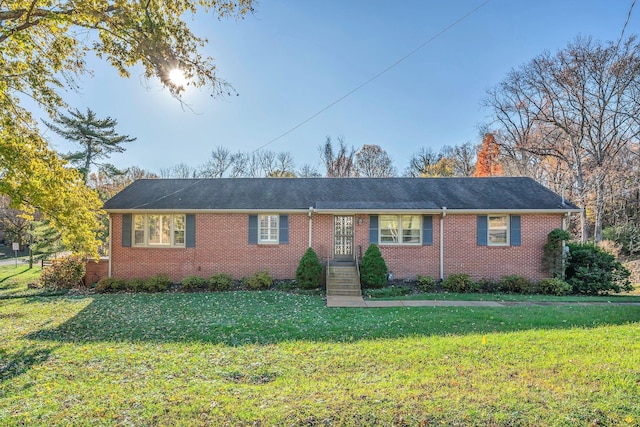 ranch-style house with a front lawn