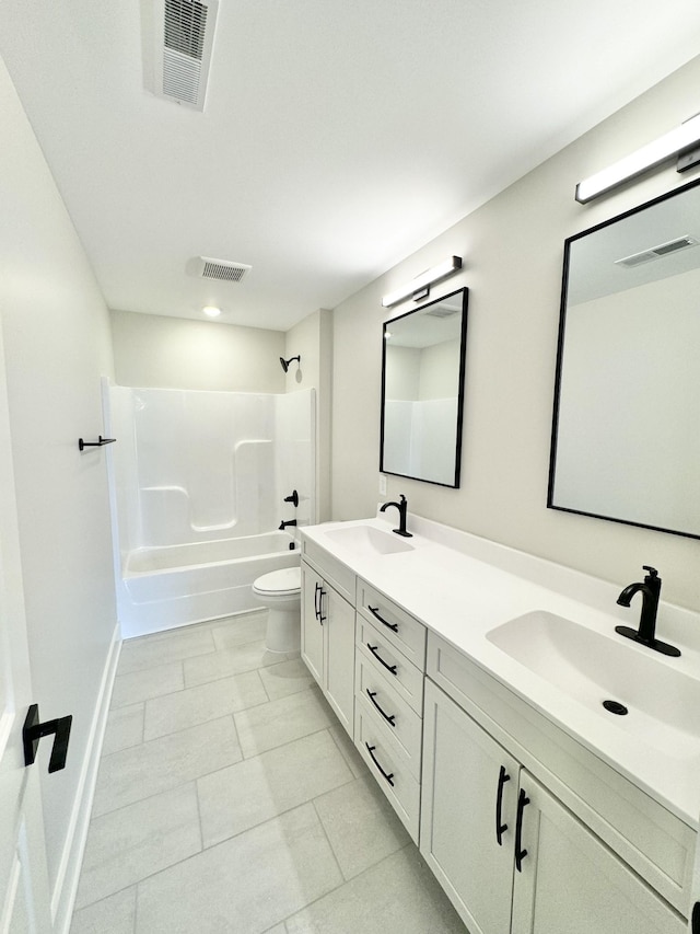 full bathroom featuring vanity, shower / tub combination, and toilet