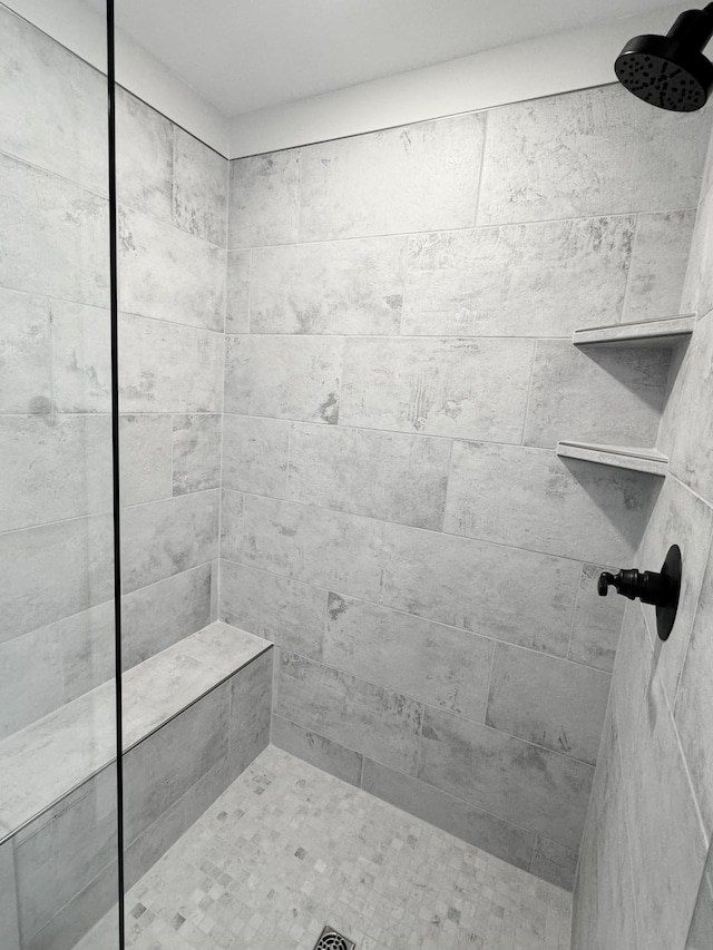 bathroom featuring tiled shower