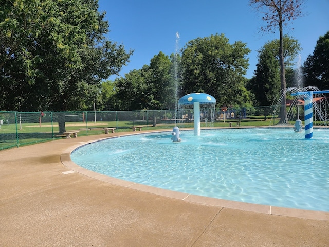 view of swimming pool featuring pool water feature