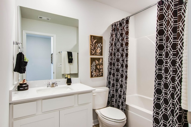 full bathroom with vanity, shower / bath combination with curtain, and toilet