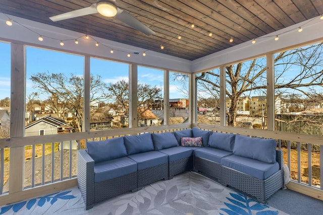 sunroom / solarium with wood ceiling and ceiling fan