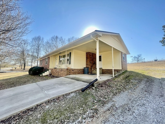 view of side of property with a carport