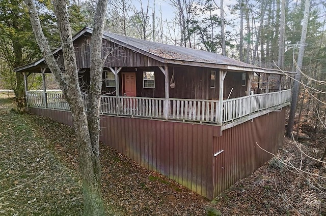 view of property exterior featuring a porch