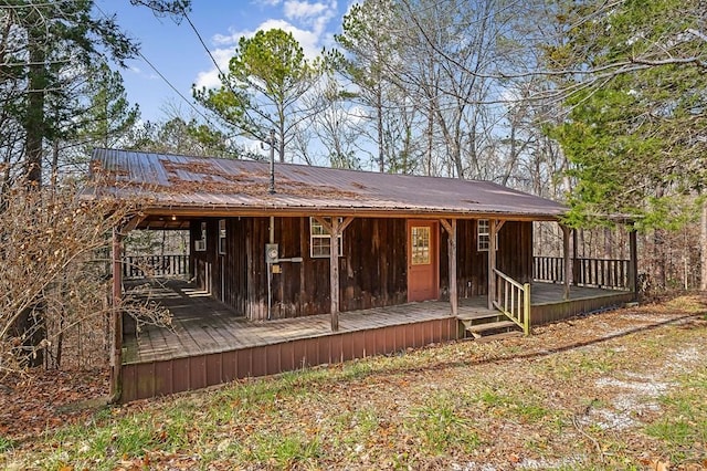 back of property featuring a deck