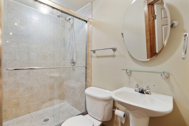 bathroom featuring toilet, sink, and walk in shower