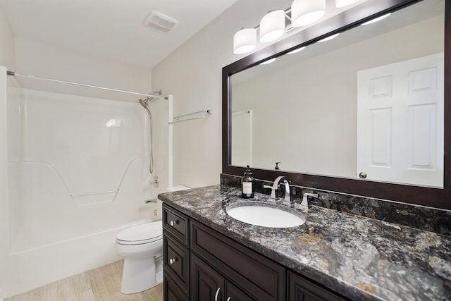 full bathroom with shower / bathing tub combination, vanity, and toilet