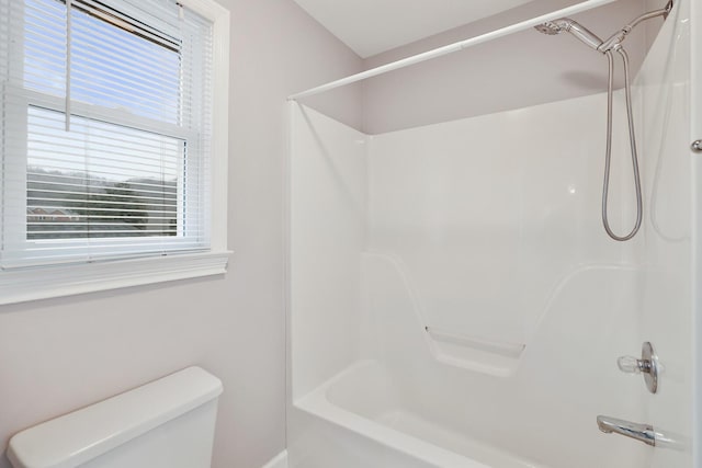 bathroom with shower / bathtub combination and toilet