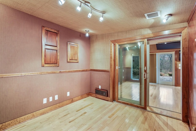 unfurnished room featuring hardwood / wood-style floors