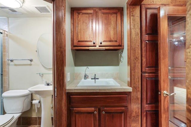 bathroom with sink and toilet