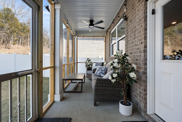 sunroom / solarium with ceiling fan