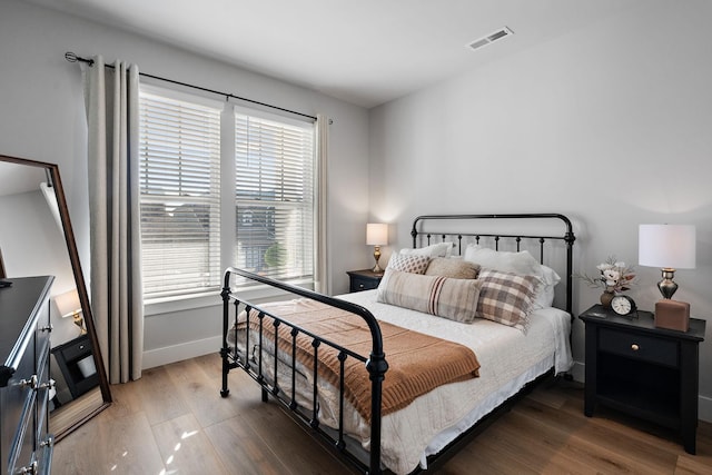 bedroom featuring dark hardwood / wood-style floors