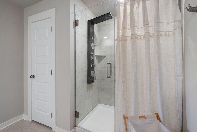 bathroom featuring walk in shower and tile patterned floors