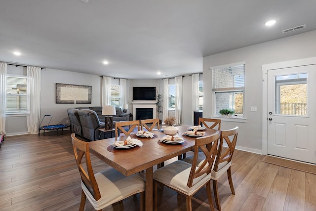 dining area with hardwood / wood-style flooring