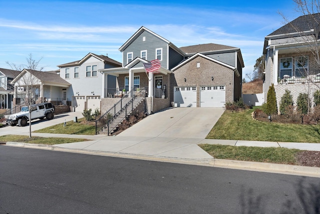 view of front of home with stairs, concrete driveway, a porch, and a residential view