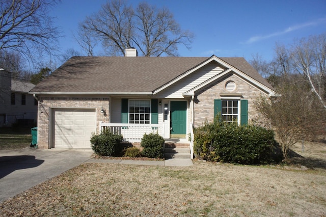 view of front of property with a garage and a front lawn