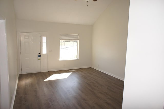 entryway featuring dark wood-type flooring, ceiling fan, and vaulted ceiling