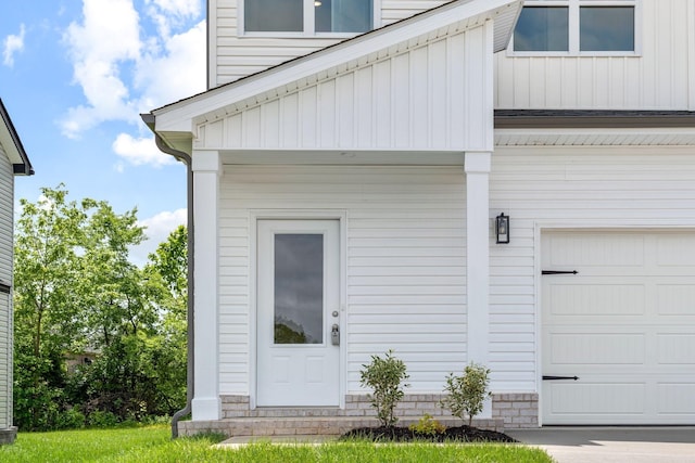 view of exterior entry featuring a garage