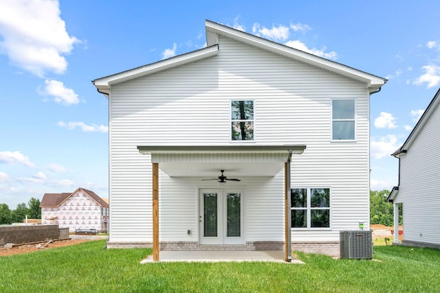 rear view of house featuring a yard, a patio area, ceiling fan, and central air condition unit