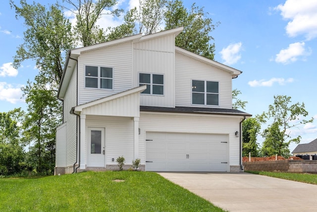 view of front of house with a garage and a front yard