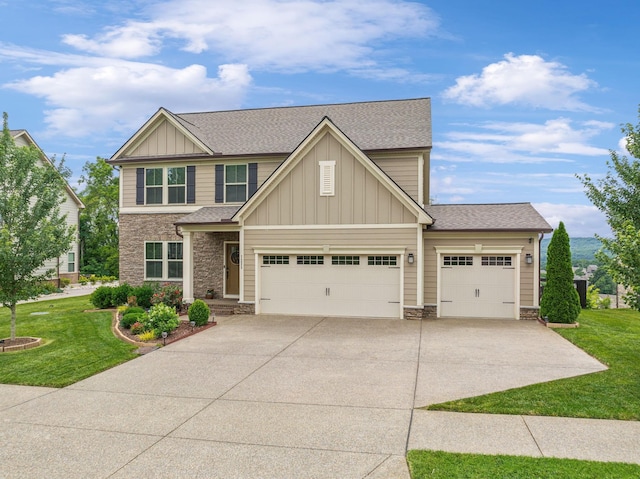 craftsman house with a garage and a front yard