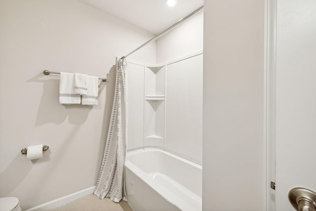 bathroom with shower / bath combination with curtain and tile patterned floors