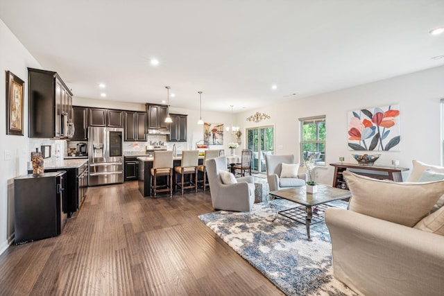 living room with dark hardwood / wood-style floors