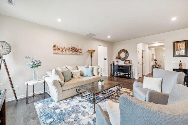 living room with dark hardwood / wood-style floors