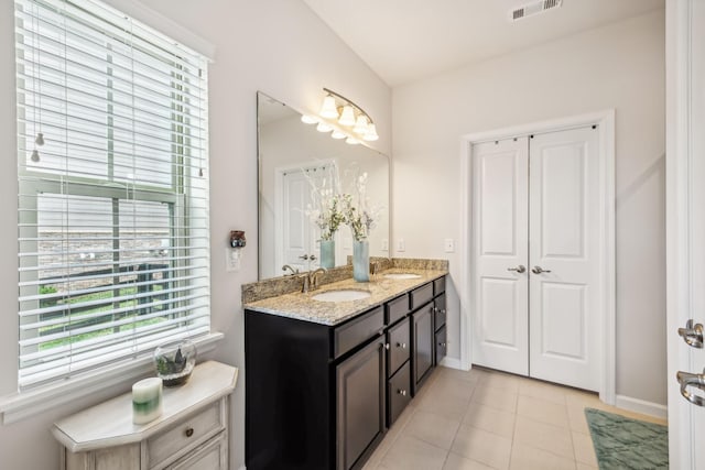 bathroom with vanity and tile patterned flooring