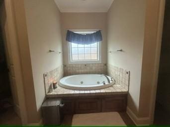 bathroom featuring tiled tub