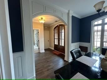 office space with dark hardwood / wood-style flooring, ornamental molding, and french doors