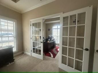 interior space with french doors and crown molding