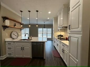 kitchen featuring decorative light fixtures, white cabinetry, sink, dark hardwood / wood-style flooring, and black appliances