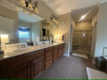 bathroom with crown molding, vanity, and plus walk in shower