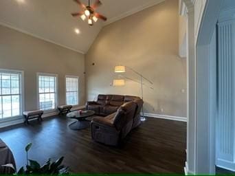 living room featuring dark wood-type flooring, ceiling fan, and high vaulted ceiling