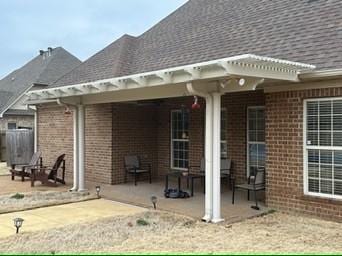 back of property featuring a patio