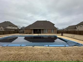 view of pool featuring a diving board