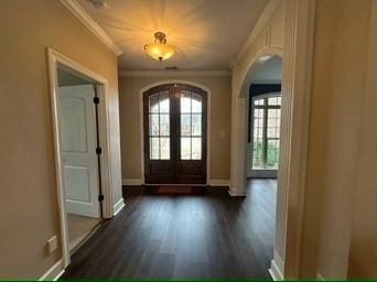 entrance foyer featuring crown molding, dark hardwood / wood-style flooring, and french doors