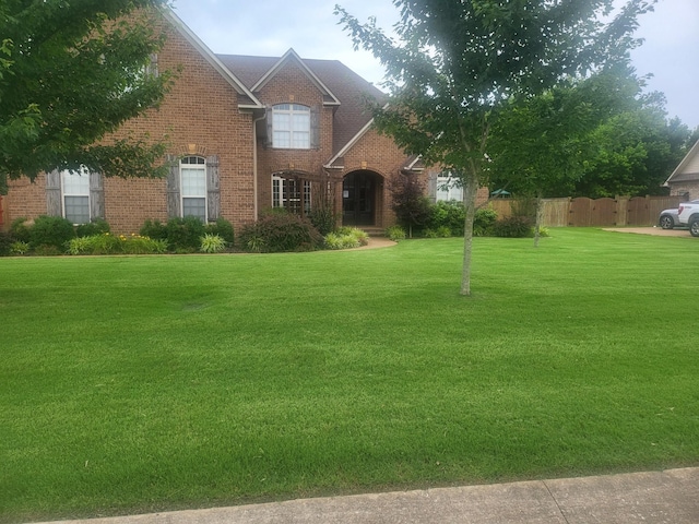 view of front of property with a front lawn