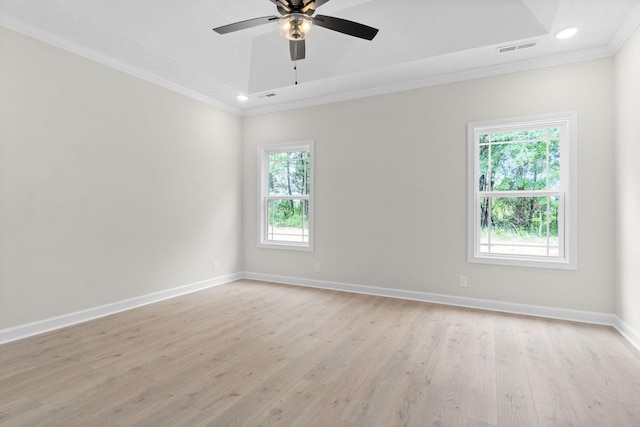 unfurnished room with ceiling fan, ornamental molding, and light wood-type flooring