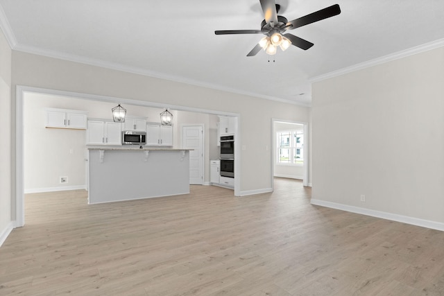 unfurnished living room with ceiling fan, ornamental molding, and light hardwood / wood-style flooring