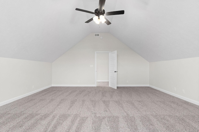 additional living space featuring ceiling fan, carpet flooring, and vaulted ceiling