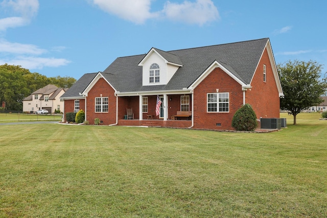 view of front of house featuring a porch, cooling unit, and a front yard