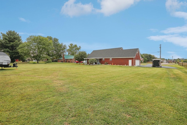 view of yard featuring a garage