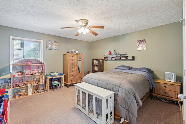 carpeted bedroom featuring ceiling fan and a textured ceiling