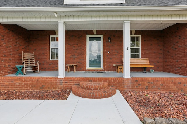 property entrance featuring a porch