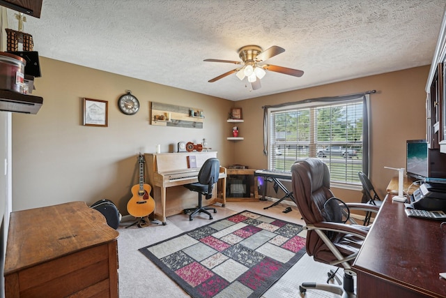 office with ceiling fan, light colored carpet, and a textured ceiling