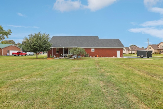 exterior space featuring a garage and a yard