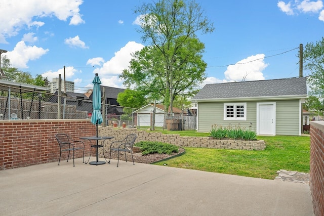 view of patio / terrace with an outbuilding